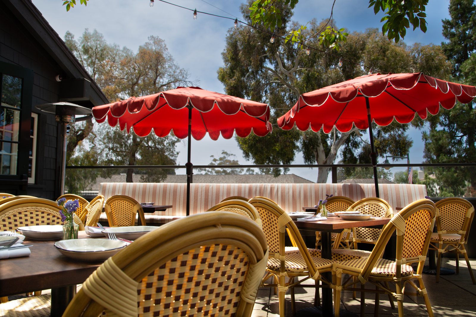 Bar Lou — patio with red umbrellas